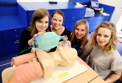 Pictured (l-r) at the launch of the Mobile Surgical Skills unit are Claire Lynch, Aoife Bates, Niamh Coen and Jessica Halligan, all of the RCSI Department of Surgical Affairs, as they view the new mobile training facility. The Mobile Surgical Skills Unit will set off from Dublin to Arusha, Tanzania, equipped with surgical training technology such as Virtual Reality simulators to train surgical trainees in hospitals across five of the ten COSECSA countries.