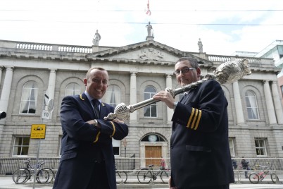 15 June 2014: left, Frank Donegan, Head Porter and Bryan Shields, Deputy head Porter, hold the Mace outside the RCSI building, St.Stephen's Green, Dublin. Meadhbh Murphy, Archivist, RCSI.