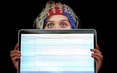 Olga Brych, clinical data scientist, with a display of EEG traces of electrical activity in her brain at the launch of FutureNeuro, a world-leading SFI Research Centre at RCSI. FutureNeuro is a €13.6 million centre that aims to translate breakthroughs in understanding of brain structure and function to transform experiences of neurological diseases.