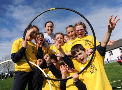 Pictured is RCSI Medicine student, Caroline Hannigan with the yellow team team during the Annual REACH RCSI Sports Day. More than 100 local boys and girls from St. Enda's Primary School, Whitefriar Street, Dublin 2 and Presentation Primary School, Warrenmount, Dublin 8 took part in the Sports Day on Thursday 10th April 2014. 