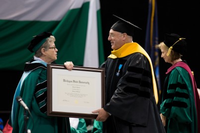 Pictured is Lou Anna K. Simon, President of Michigan State University (MSU),   presenting an honorary doctorate of science to  Professor Brian Harvey, Professor of Molecular Medicine,  RCSI at a ceremony that took place at MSU on 3rd May.