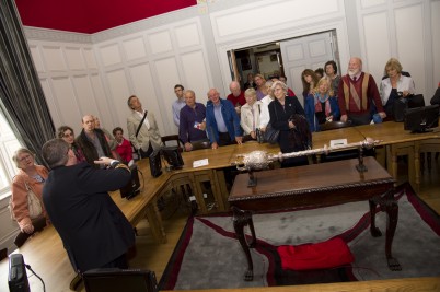 Frank Donegan, Head Porter of RCSI, is pictured in the Council Chamber giving a tour of the College to  members of the public as part of National Heritage Week at RCSI.