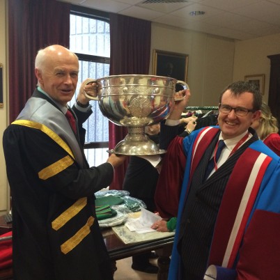 Pictured (l-r) is Prof Cathal Kelly, CEO/Registrar, RCSI and Prof Paul Gallagher, Head of RCSI School of Pharmacy holding the Sam Maguire cup aloft before the November Conferring ceremonies on 18th November. BSc Physiotherapy Graduate, Donnchadh Walsh (a member of the 2014 All-Ireland winning Kerry side) brought the trophy to Dublin for the occasion.