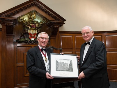 Pictured at the Council Dinner at RCSI on 10th December (l-r) is Mr Declan Magee, President, RCSI and Terry Slattery. Terry is being presented with a print of the College as a token of appreciation as he is stepping down from his role as macebearer. Terry’s last function in this role will be the Charter Day Dinner in February 2015.