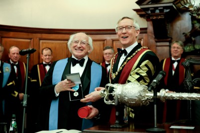 Pictured is RCSI President, Mr Declan Magee presenting President of Ireland, Michael D.Higgins with an Honorary Fellowship of RCSI while members of the RCSI Council watch on in the background. This Honorary Fellowship was bestowed on Uachtarán na hÉireann at the Charter Day Dinner on Saturday 13th February at the College on St Stephen’s Green.