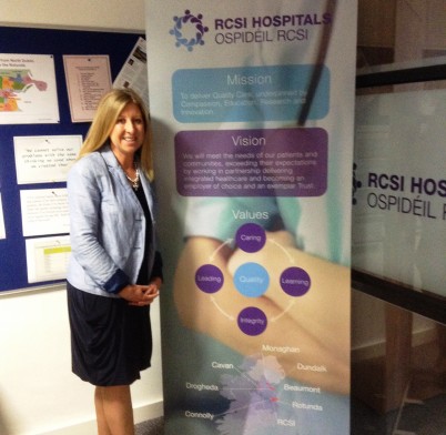 Pictured is Dr Mary Collins, Senior Executive Development Specialist, RCSI Institute of Leadership beside a banner displaying the RCSI Hospitals Group Vision, Mission and Value statements, agreed after a series of  workshops with the Hospital Group leadership team facilitated by a team from the Institute of Leadership.